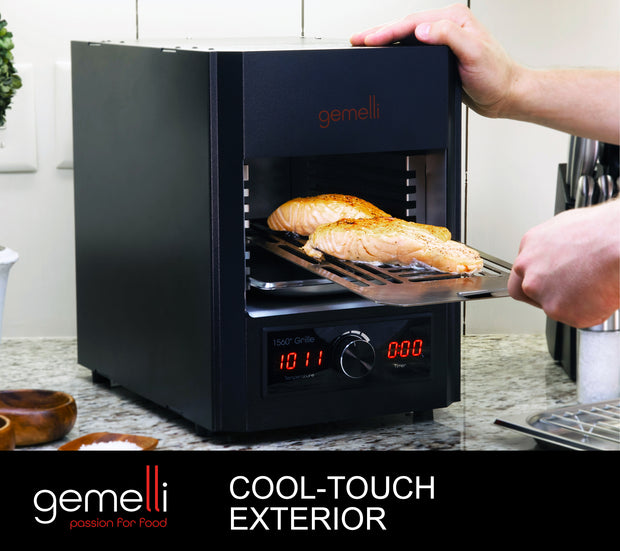 Gemelli Home Steak Grille on counter with salmon being removed. Hand is resting on the top of the unit. Digital display temperature reads 1011ºF. Caption: Cool-Touch Exterior